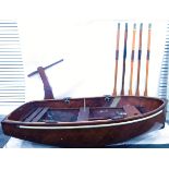 Wooden hand-built four-oar dinghy/cat boat with five wooden oars, four metal rowlocks,