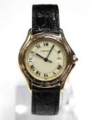 Cartier Cougar De Cartier wristwatch 1611 in yellow gold case, champagne dial, yellow gold bezel,