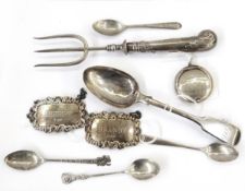 Two silver decanter labels, Sherry and Brandy, fiddle pattern silver dessert spoon, a bread fork,