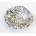 Victorian silver shell dish with foliate bead and engraved decoration, on three ball feet,