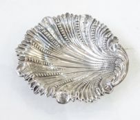 Victorian silver shell dish with foliate bead and engraved decoration, on three ball feet,