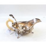 Silver sauce boat with ivory handle,