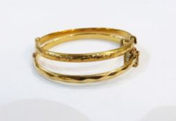 18ct gold plated bangle with faceted decoration and a rolled gold bangle with engraved decoration