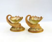 Pair of Victorian Royal Worcester porcelain shell dishes, each with exotic fish support,