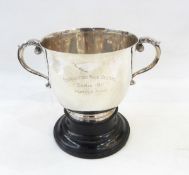 Silver two-handled trophy cup with flared rim on a raised ebonised circular foot "Coronation Race