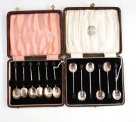 Two sets of six silver bean-topped coffee spoons,