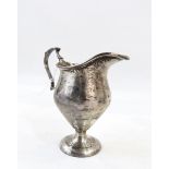 George V silver cream jug, inverse baluster shape, scrolled handle, on circular foot, 10cms high,