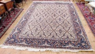 Indo-Persian ivory and blue carpet,
