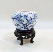 Oriental blue and white porcelain vase, bulbous and tapering, decorated with prunus trees and birds,