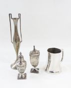 Silver spill vase in Egyptian-style with hammered decoration, a silver pepperette,