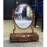 Reproduction mahogany oval toilet mirror of three drawers, on bracket feet,