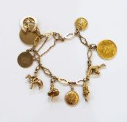 9ct. gold charm bracelet, shaped oval link with various charms including Victorian half sov.