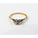 18ct gold and diamond two-stone ring, the stones set in platinum, each diamond 3mm in diameter,