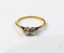 18ct gold and diamond two-stone ring, the stones set in platinum, each diamond 3mm in diameter,