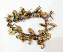 9ct gold charm bracelet with numerous charms, mainly 9ct, 39.6g approx.