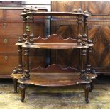 19th century carved mahogany three-tier whatnot, with turned finials, on turned legs and castors,