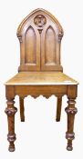 Oak hall chair with arched shaped back,