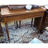 19th century oak rectangular fold-out card table on turned supports,