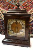 Regency-style mahogany bracket clock with urn finial,