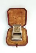 Tissot travelling purse clock, the square dial with Arabic numerals and inscribed 'Tissot Huber',