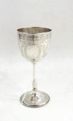 Victorian silver goblet, the engraved cup on a shaped stem, on a circular base,