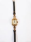 Art Deco-style gold-coloured twin-strap wristwatch