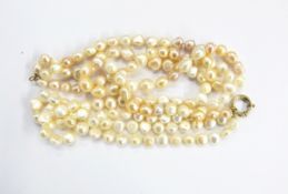 Three-strand champagne and cream baroque pearl necklace with gold coloured metal clasp, approx.