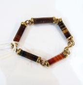 Rolled gold and agate bracelet having five cylindrical and facet-cut links