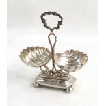 Polish silver coloured metal shell condiment stand, the central scroll handle,