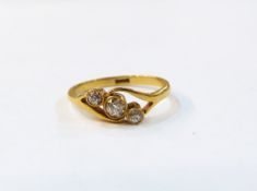 Gold and diamond three-stone ring, gold mark worn,