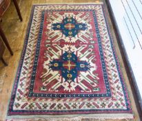 Turkish Kars wool rug with two stylised blue and pink medallions,