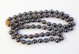 Oriental string of black cultured pearls and gold-coloured beads
