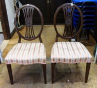 Pair of mahogany oval pierced back dining chairs with upholstered pink seats,