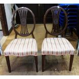 Pair of mahogany oval pierced back dining chairs with upholstered pink seats,