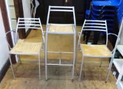 20th century silver coloured metal and wooden inset seat bar stool and a set of four matching