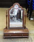 Mahogany shaped swing frame mirror above two drawers, on bun feet,