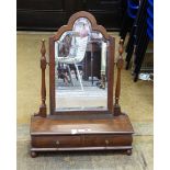 Mahogany shaped swing frame mirror above two drawers, on bun feet,