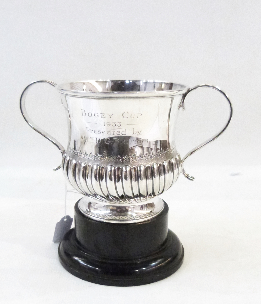 Silver two-handled cup by Atkin Bros, Sheffield 1914 of half-fluted form with reeded scroll handles,