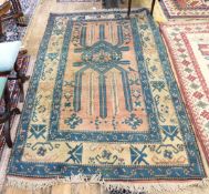 Turkish Kars wool rug with pale blue, pink and ivory medallion with stylised leaves,