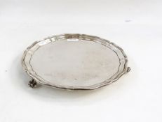 Silver salver by S Blanckensee & Son, Chester 1929, of shaped circular form, on three scroll feet,