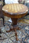 Victorian work / games table with inlaid decoration, circular on a tripod base,