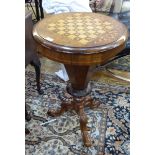 Victorian work / games table with inlaid decoration, circular on a tripod base,
