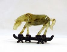 Oriental carved jade model of a horse,13 cms long,