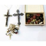 Two silver-coloured crucifixes, various agate and other beads,