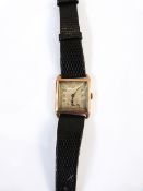 Gent's Swiss gold-cased wristwatch with black leather strap