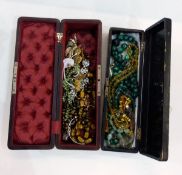 Two glove boxes and contents of costume jewellery including an engraved silver bangle,