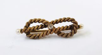 Gold-coloured rope-twist, diamond and seedpearl bar brooch in the form of a knot,