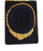 1970's 9ct gold stylised fringe necklace of textured design, approx.