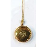 9ct gold circular locket on chain with engraved decoration, 4.