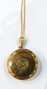 9ct gold circular locket on chain with engraved decoration, 4.